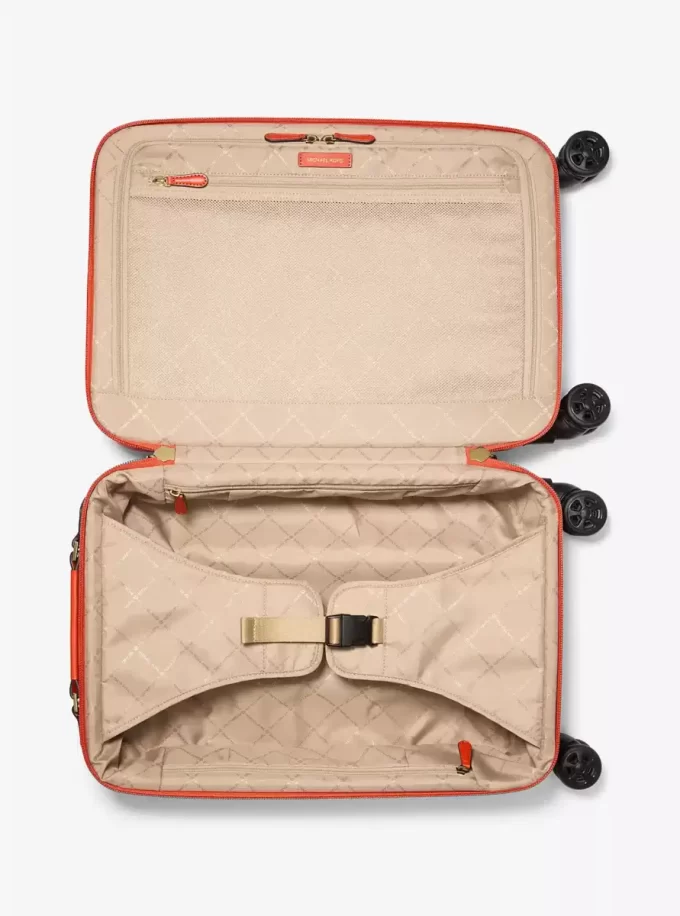 Mała walizka z logo w kropki