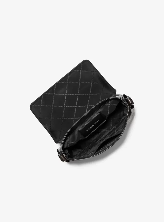 Mała, zniszczona torba na ramię Cyrus