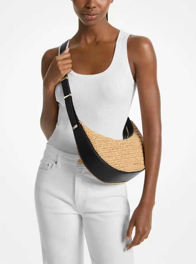 Średniej wielkości torebka Avra  wykonana ręcznie na szydełku ze skóry i materiału typu crossbody